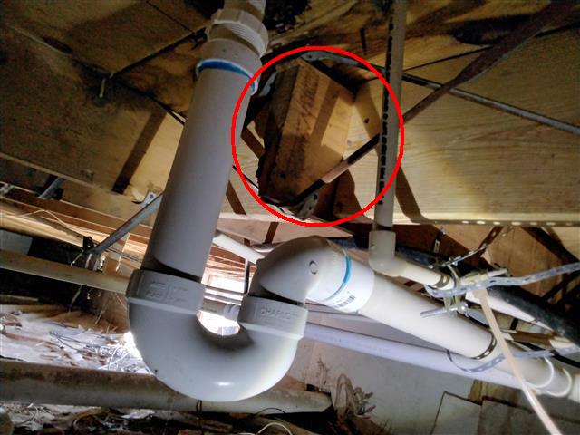 floor joist cut for tub drain